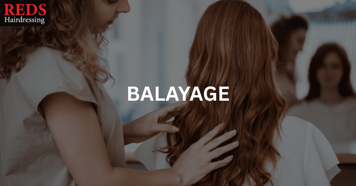 woman receiving treatment from stylist for balayage hair
